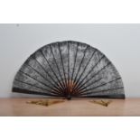 A Tortoise shell fan, with lace leaf, 34.5cm in length, together with two smaller pierced examples