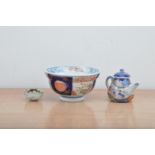 Three items of Far Eastern ceramics, comprising a porcelain bowl with hand painted decoration and