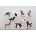 A collection of animal ceramic figurines, including Beswick foals and a donkey, and an assortment of
