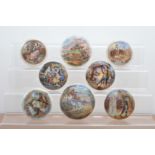 A collection of 19th century Staffordshire ceramic Prattware pot lids, of varying styles and