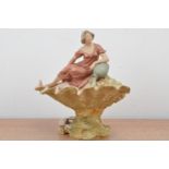 A Royal Dux ceramic figurine of a lady on a shell, worn marks to the underside, some wear to the