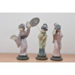 Three Lladro ceramic Japanese lady figurines, all with fans, one with an umbrella, marked to the