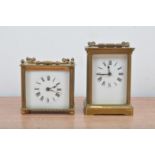 Two 20th century brass carriage clocks, of different sizes, both with enamel dials with roman