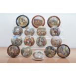 A collection of 19th century Staffordshire ceramic Prattware pot lids, of varying styles and