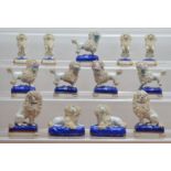 A collection of 19th century ceramic Staffordshire poodles, comprising six pairs and a single