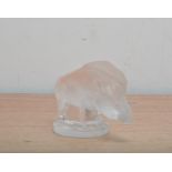 A Lalique glass wild bore, on a circular base, ‘Lalique France’ to the side of the base, 7cm high