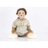 An Edmund Edelmann Melitta character baby, with blue lashed sleeping eyes, brown mohair wig, bent-