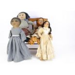 Four cloth dolls, a handmade doll with nicely embroidered features, painted hair, blue and white