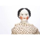 A rare Kloster Veilsdorf china shoulder-head Grenier-type child doll 1860s, with brown painted eyes,