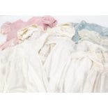 A small quantity of children and baby clothes, a white muslin dress with blue smocking, a pink satin