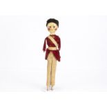 A rare late 18th century English carved and painted wooden British soldier doll, with inset dark