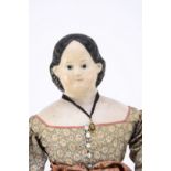 A mid 19th century Grenier papier-mache shoulder head doll, with blue painted eyes, black painted