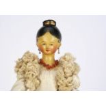 A large early 19th century Grodnerthal carved and painted wooden lady doll, with pale green eyes,