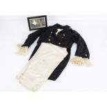 A boy’s fancy dress tailcoat and satin trousers, the jacket with net cuffs and brass buttons, a