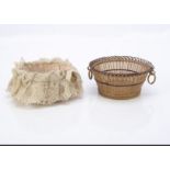 Two small 19th century circular baskets, with handles, one with pink glazed muslin and lace