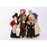 Six cloth dolls, a Dutch man and woman of stockinette, original clothes and wooden clogs, possibly