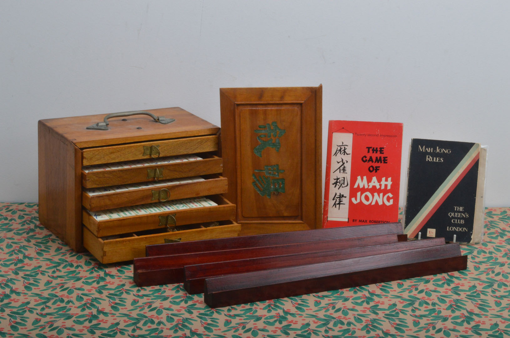 A 20th century Mah-jong set, in a fitted wooden box, pull up top enclosing five drawers, 148 bone