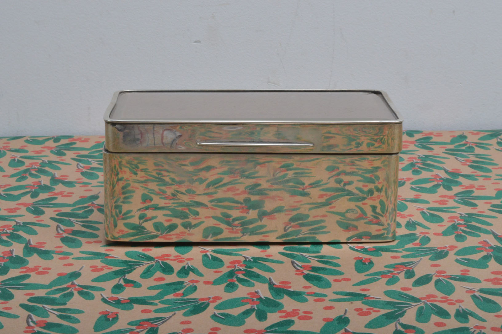 An Edward silver cigarette box, AF, 16cm wide, with glazed top to support a photograph possibly,