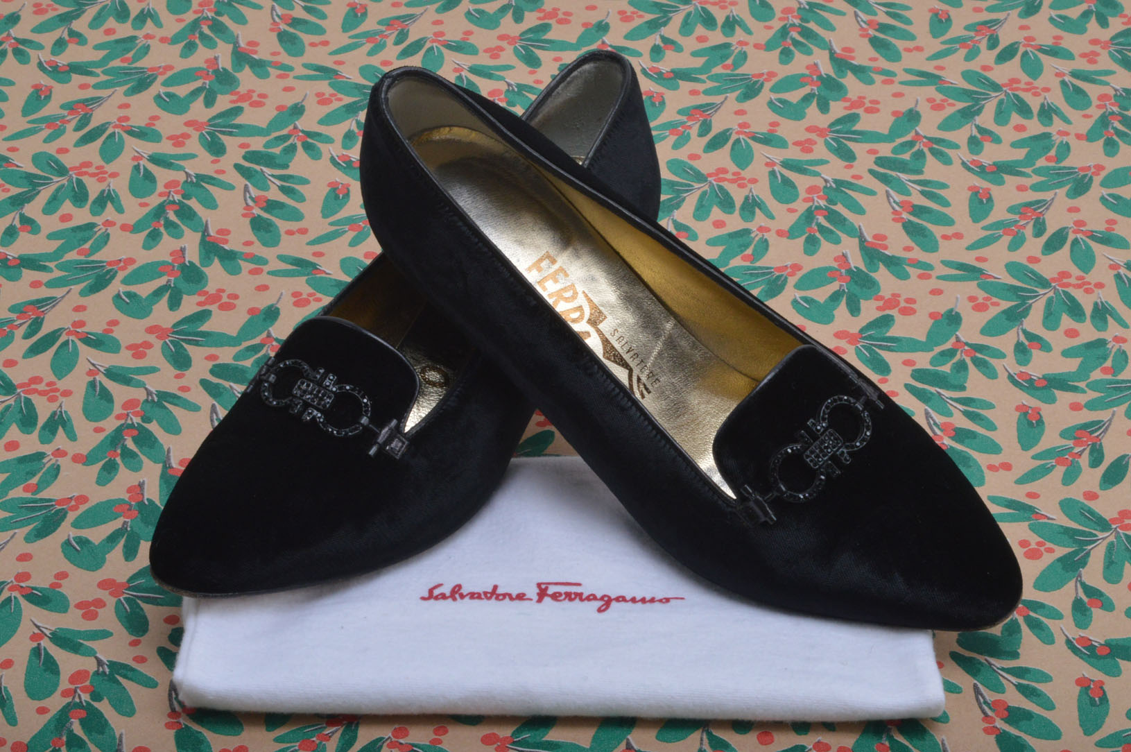 A pair of very smart Salvatore Ferragamo black velvet shoes, with black buckle and having court