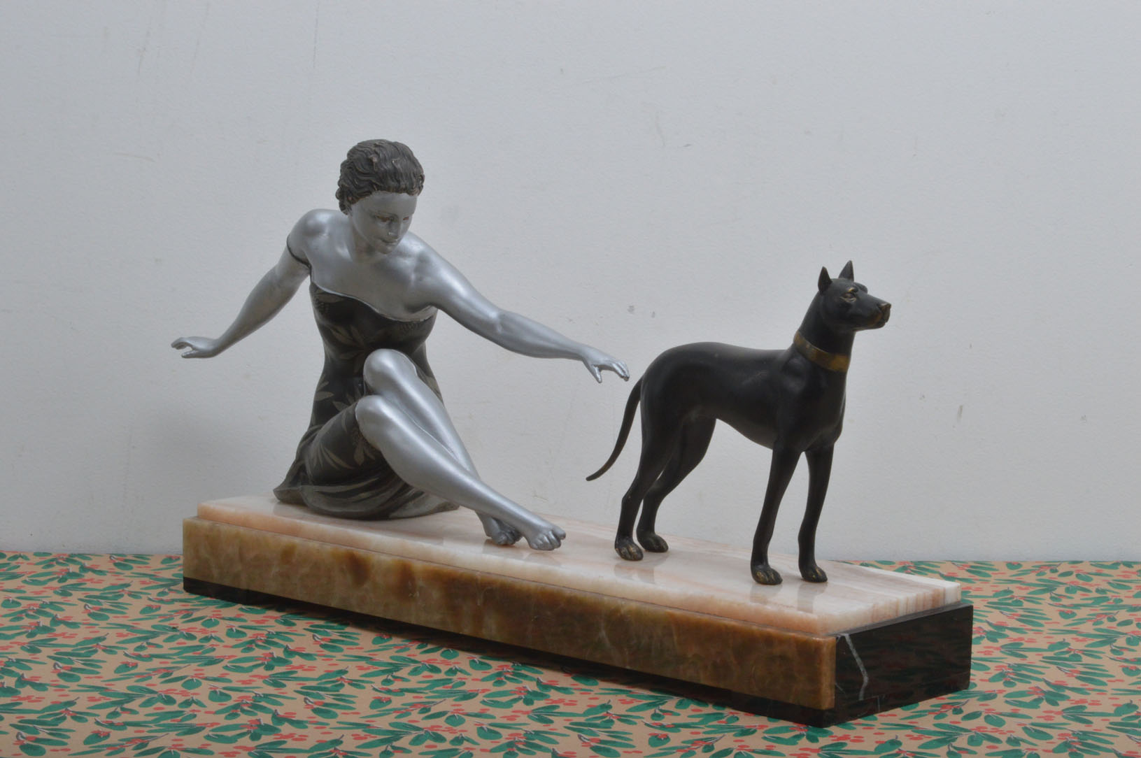 An Art Deco and later painted spelter figure of a lady and a Doberman dog after Uriano, presented on - Image 2 of 3