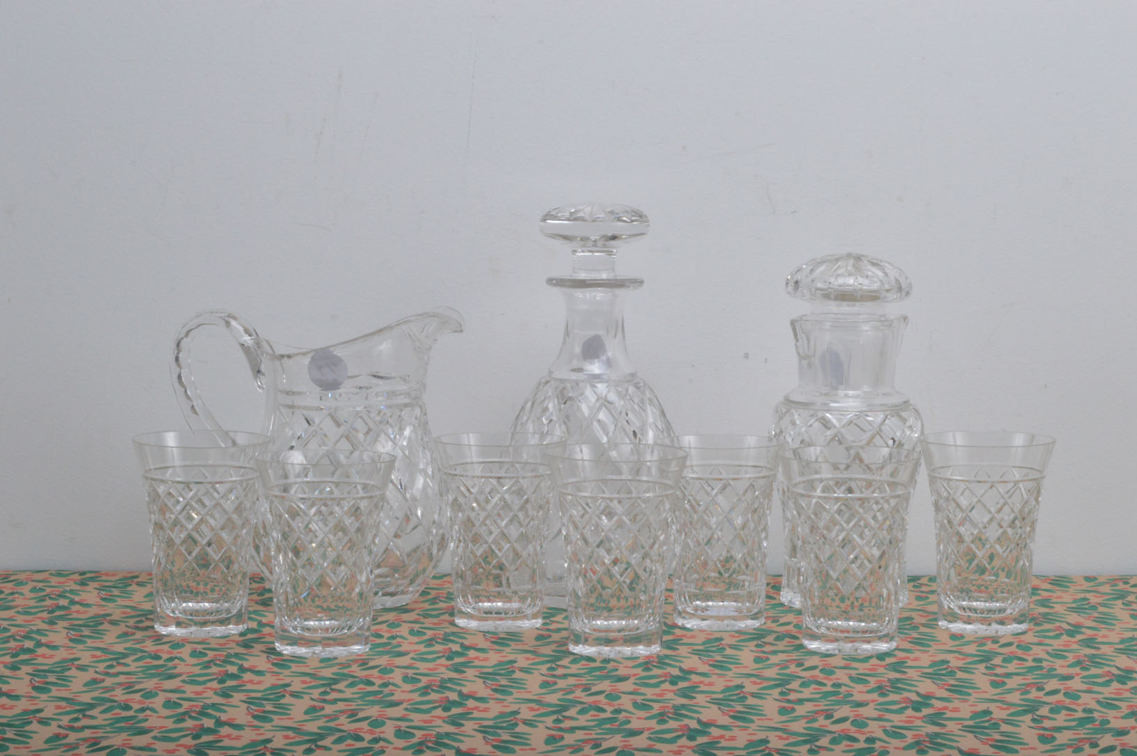 A set of six glasses with matching jug and cocktail shaker and decanter, perfect for making those