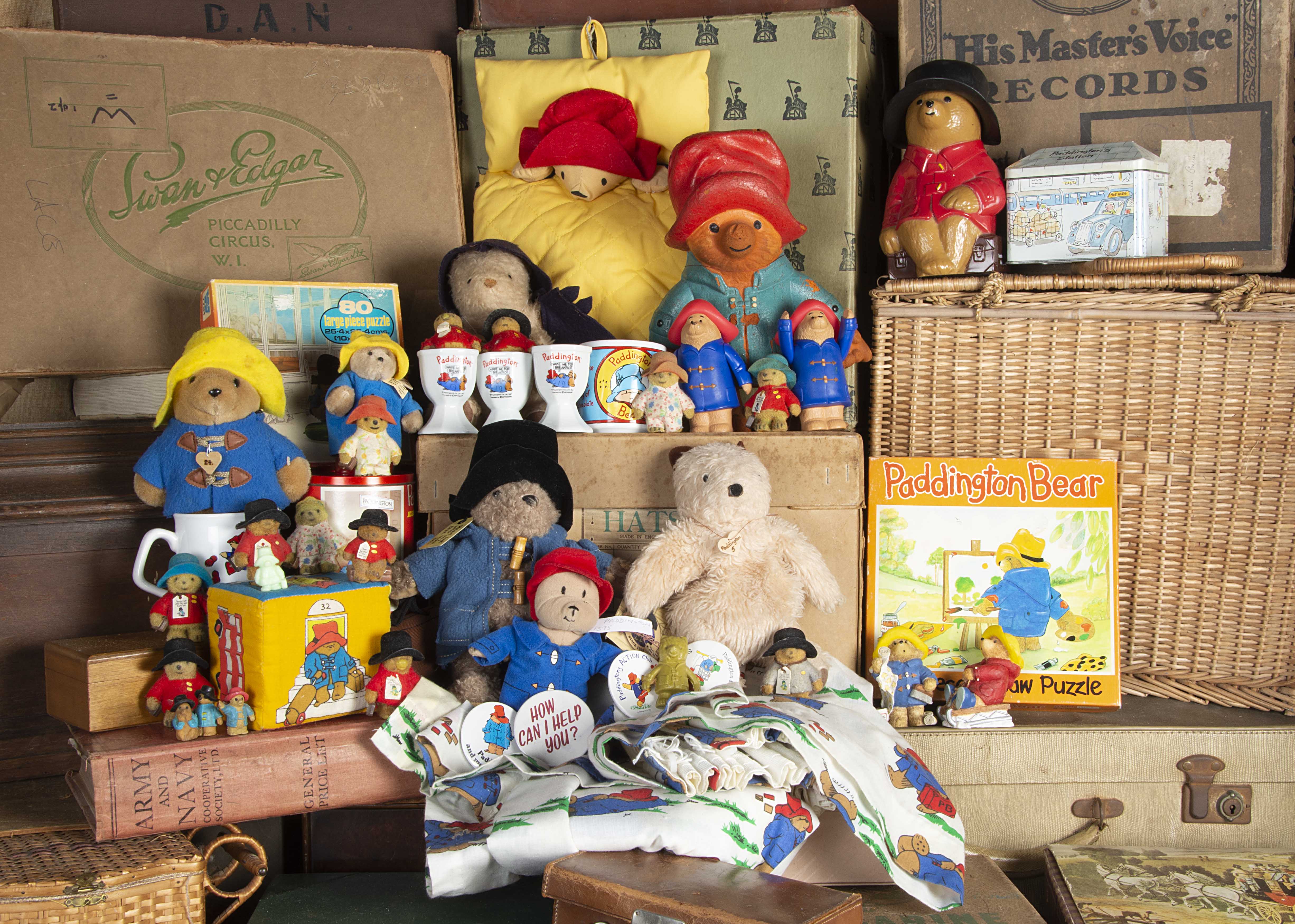 Paddington toys and memorabilia. including nine boxed jigsaws, a pair of curtains, a plastic money