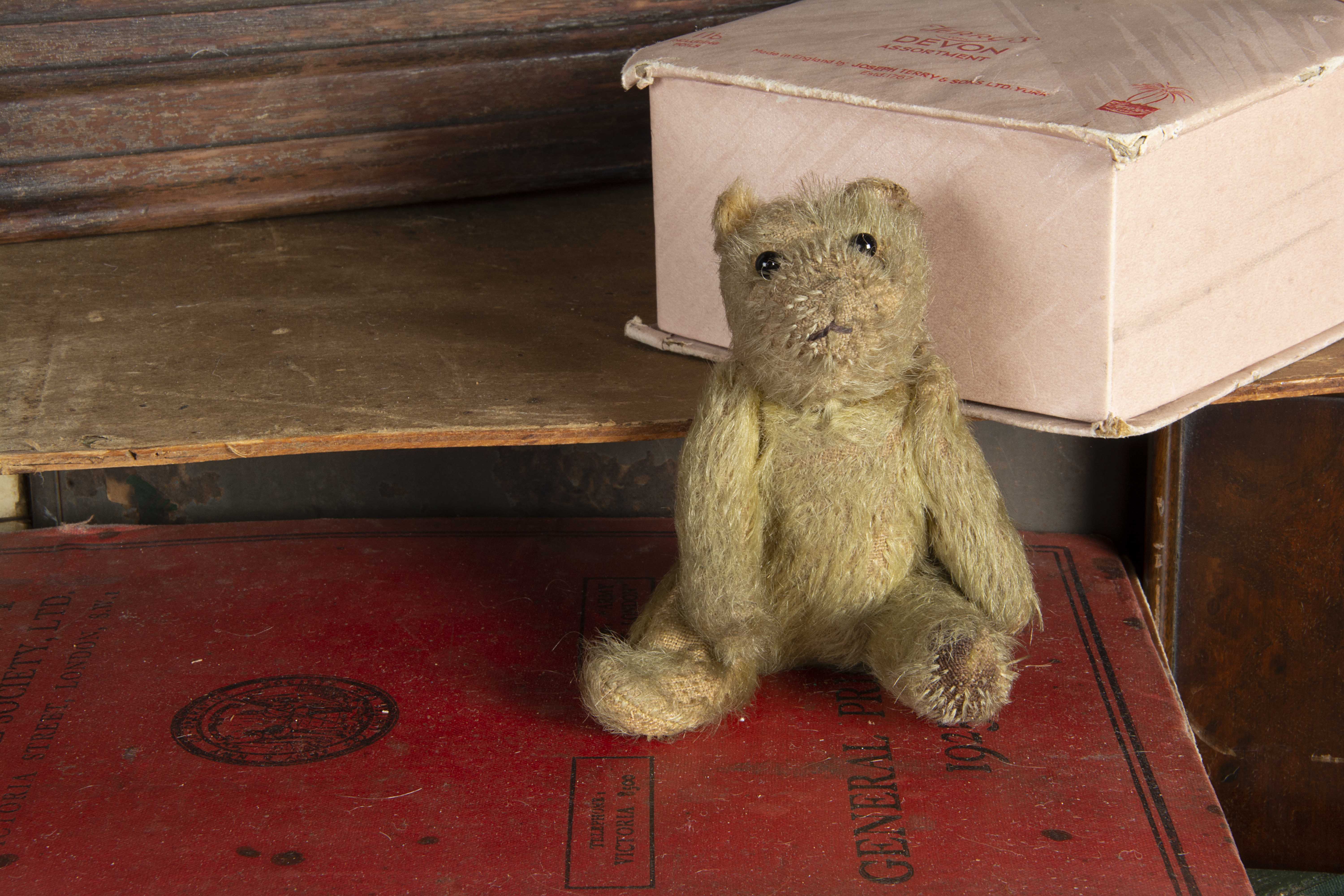 A larger size British WWI soldier Teddy Bear, with blonde mohair, black boot button eyes, black