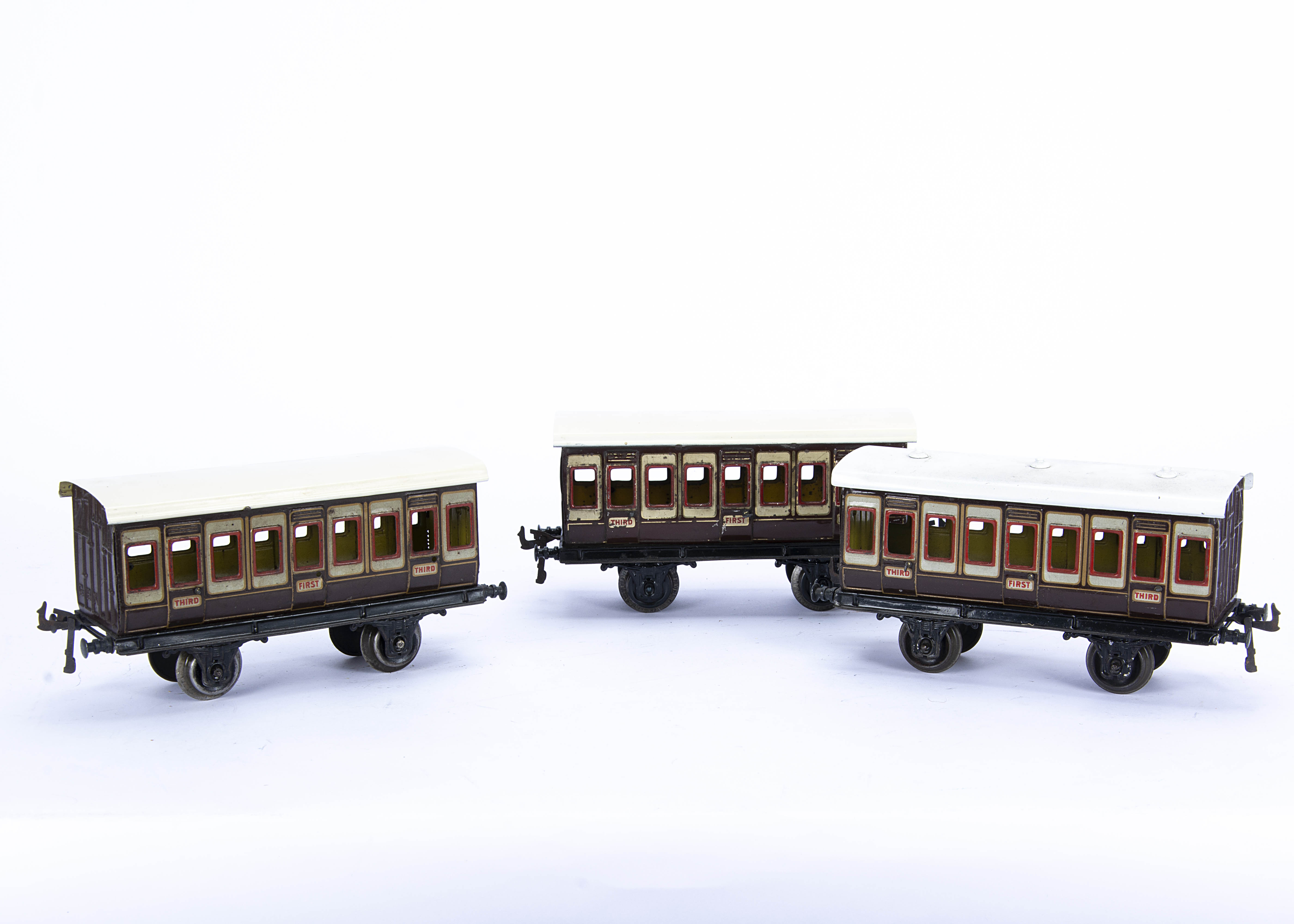 Three early Bing Gauge 1 LNWR Four-wheeled Coaches, circa 1912, in LNWR plum and ivory with 'GBN'