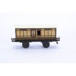 An uncommon early Bing Gauge 1 LSWR Four-wheeled Brake Coach, circa 1908, in LSWR salmon pink and