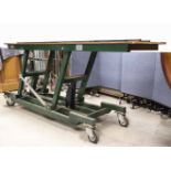 A substantially-built Elevating Engineer's Table, with manually-operated hydraulic lifting