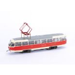 A modified and motorised 0 Gauge Prague Tatra T3 type tram by Premium Classixxs, in Prague red/cream