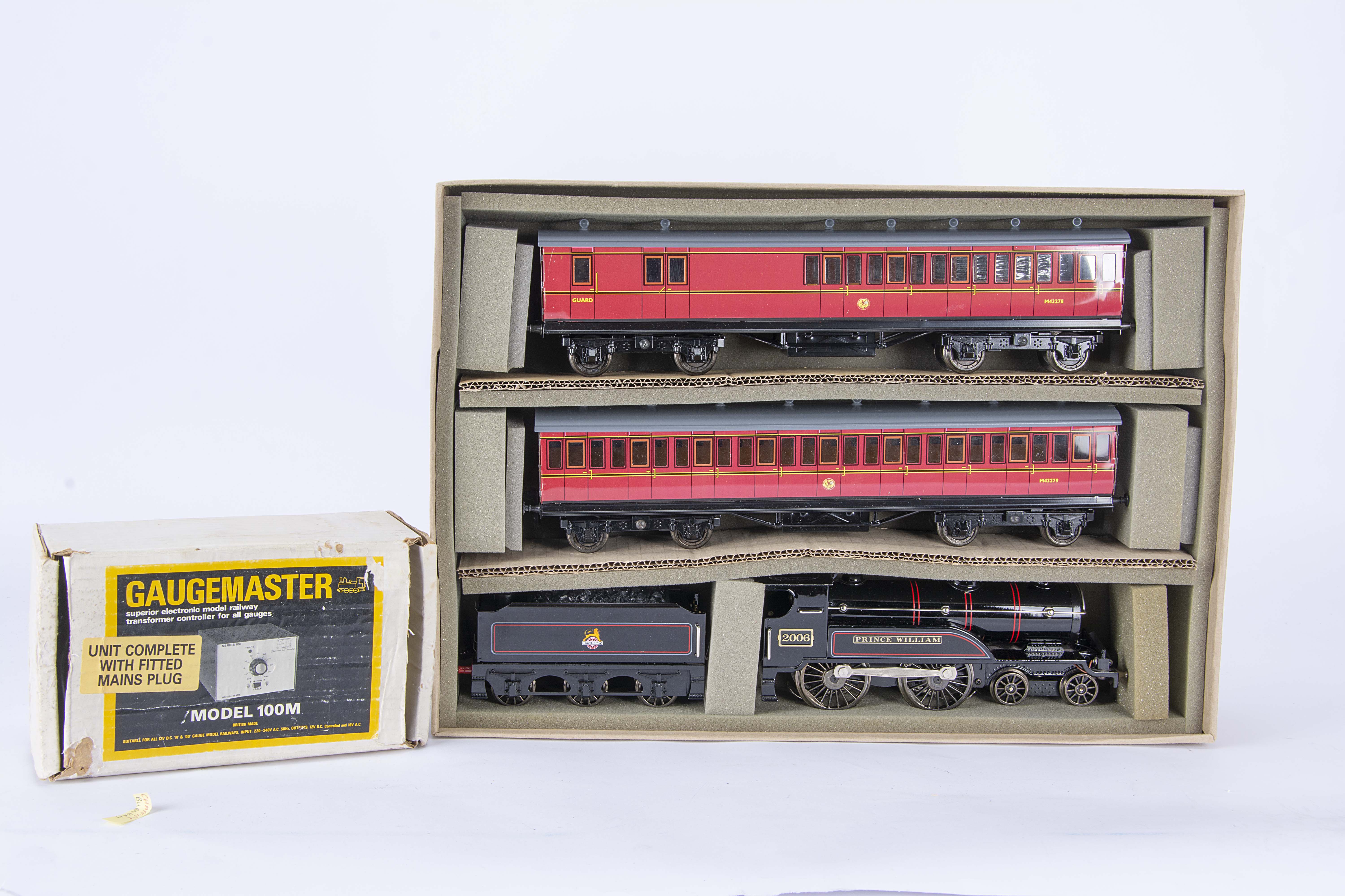 An ACE Trains 0 Gauge 3-rail BR Train Set and older electric track, comprising lined black '