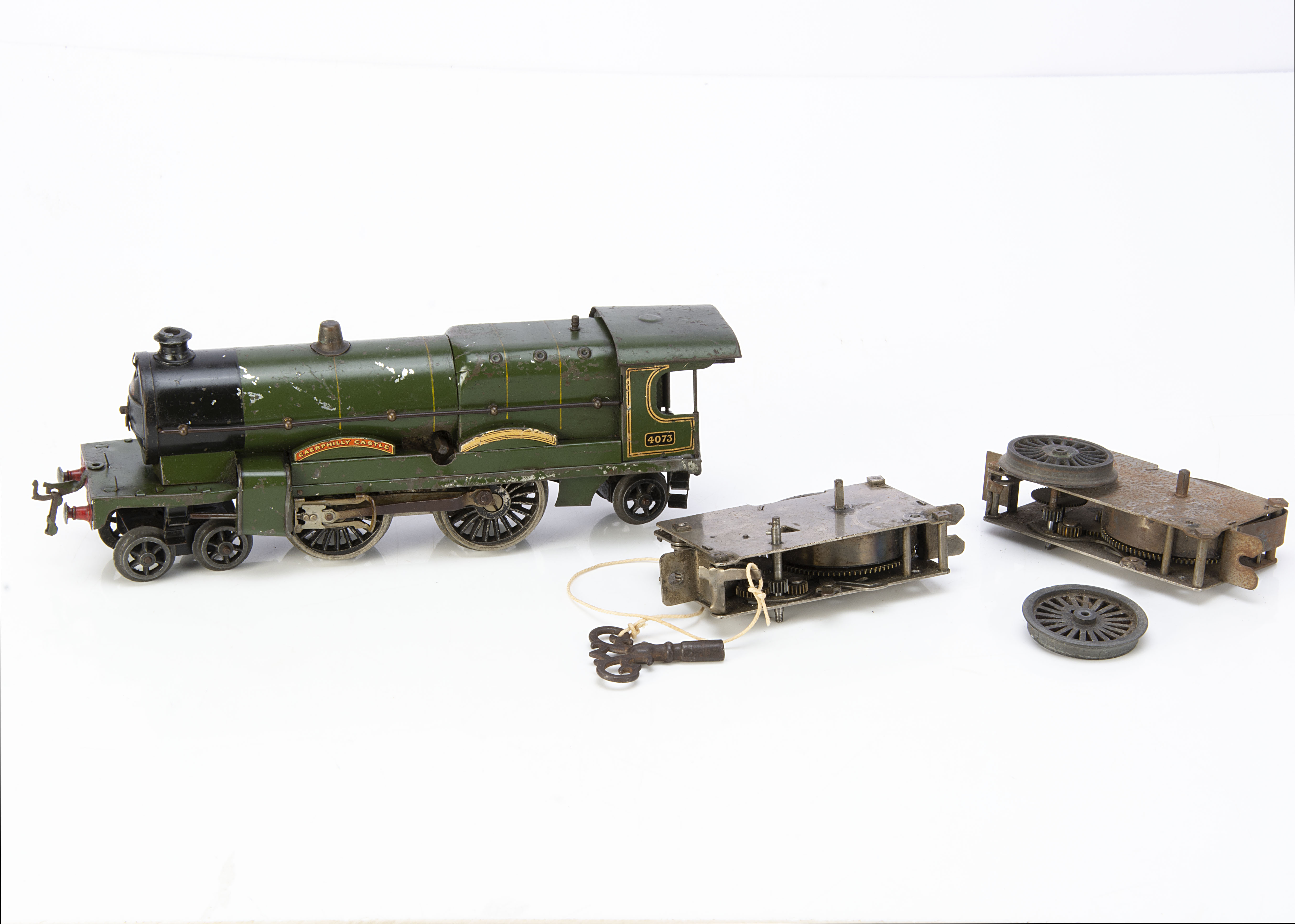 A Hornby 0 Gauge clockwork 'Caerphilly Castle' Locomotive and spare mechanisms, the loco in lined