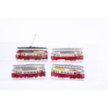 Four motorised Corgi 00 Gauge 'Feltham' Bogie Trams, now fitted with central motors with prop-