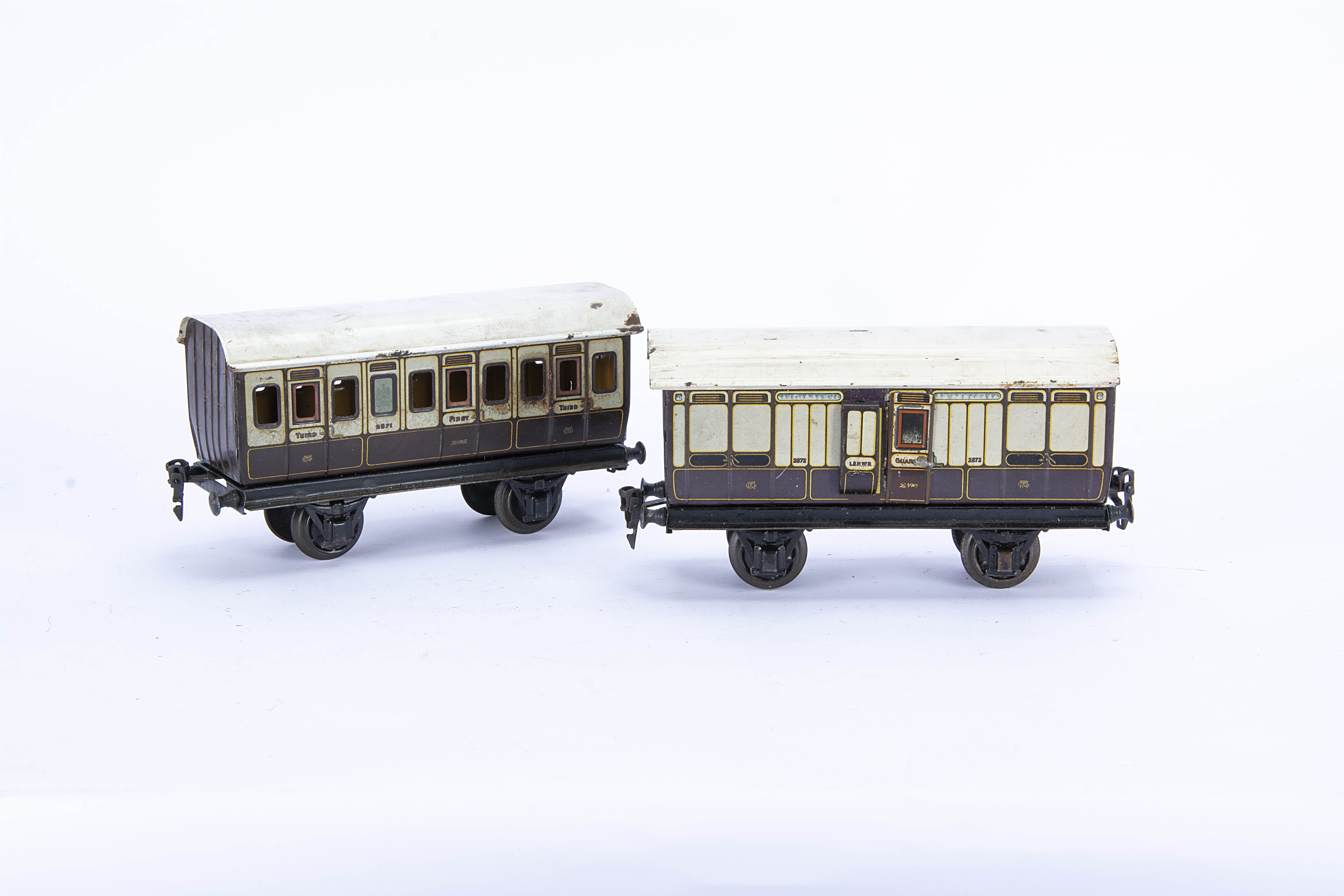 Two early Märklin Gauge 1 L&NWR Four-wheeled Coaches, in lithographed L&NWR plum and ivory, one