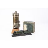 A brass Centre-flue Boiler Bassett-Lowke Paper-Weight model and Meccano Motor, the boiler approx