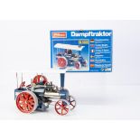 A boxed Wilesco D405 live steam 'Dampftraktor, in blue with red wheels and white roof, slip-