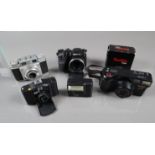 Various Cameras, a Minox 35 GT, a Panasonic G-2000ZM compact, an Agfa Super Silette, a Fujifilm