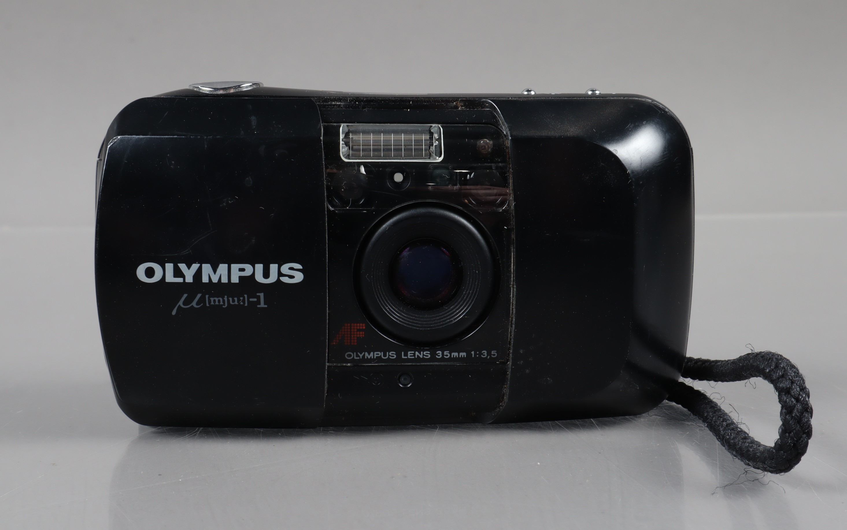 An Olympus mju 1 Compact Camera, powers up, shutter working, flash working, self timer working, body