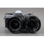 A Canon AE-1 SLR Camera, chrome, shutter working, meter responsive, self timer working, body G, with