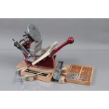 An Adana Five-Three Printing Press, with ink disk, two inking rollers, gripper finger, a quantity of