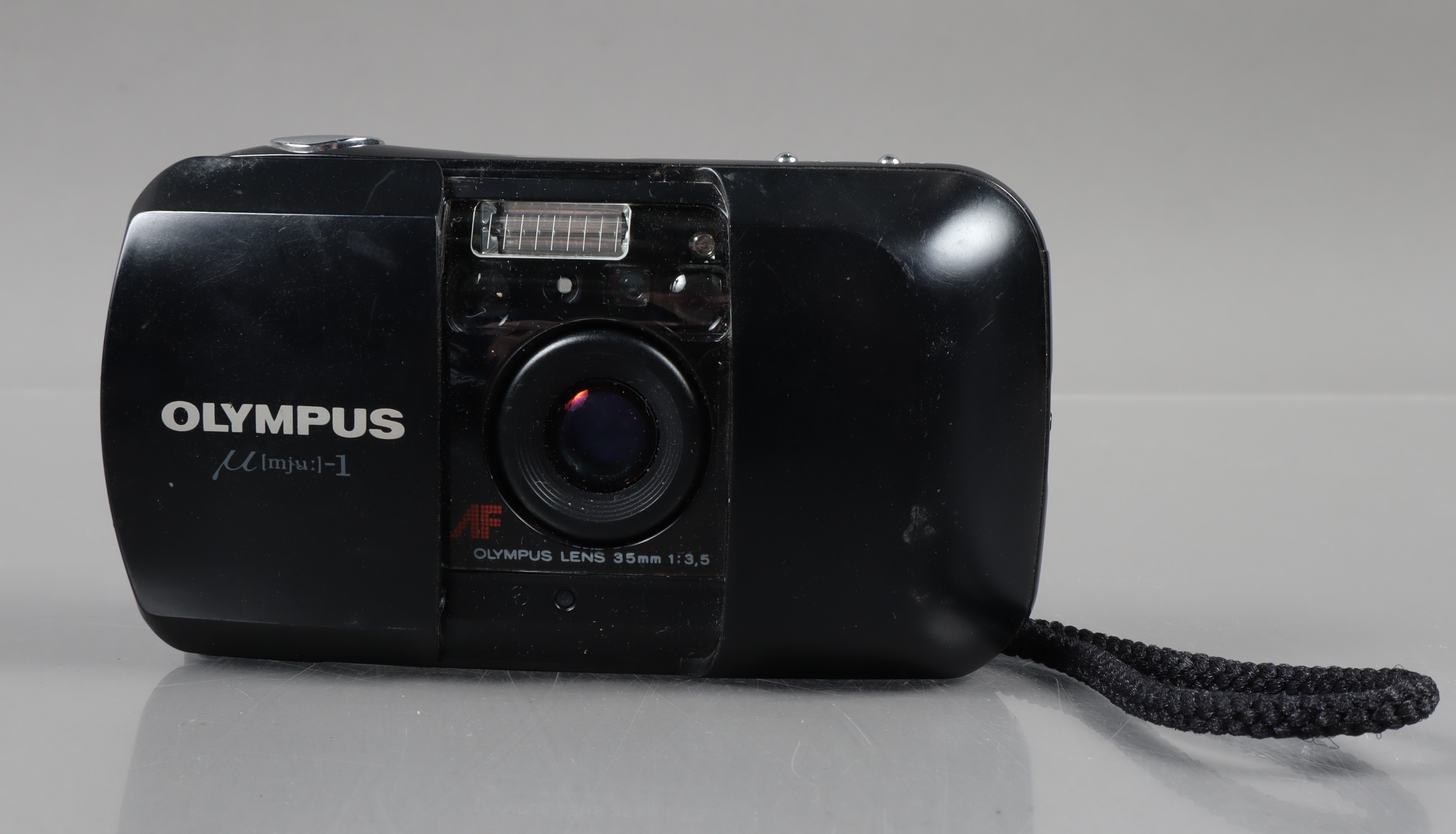 An Olympus mju 1 Compact Camera, powers up, shutter working, flash working, self timer working, body