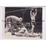 BOXING PRESS PHOTOS / ROCKY MARCIANO Two original b/w 9" X 7" action Press photos, with stamps on
