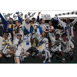 LEEDS UNITED / AUTOGRAPHS A 12 X 8 photo of players celebrating with the First Division trophy at