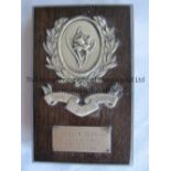 VICTOR LODORUM AWARD A 7" wooden plaque with engraved metal plate advising of the award to B.T.