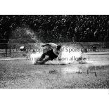 TOM FINNEY / AUTOGRAPH A 12 X 8 photo of the Preston outside-right in a shower of spray which almost