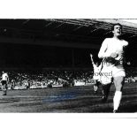 GEOFF HURST / AUTOGRAPHS Two 12 X 8 photos of the England striker running away in celebration