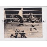 BOXING PRESS PHOTOS Three original 9" X 7" b/w Press photos, 2 of which have stamps on the