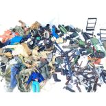 A Collection of Action Man Uniforms and Guns.