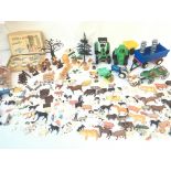 A Box Containing A Collection of Plastic Farm Yard Animals. Tractors. And a Vintage Kiddie Kitchen